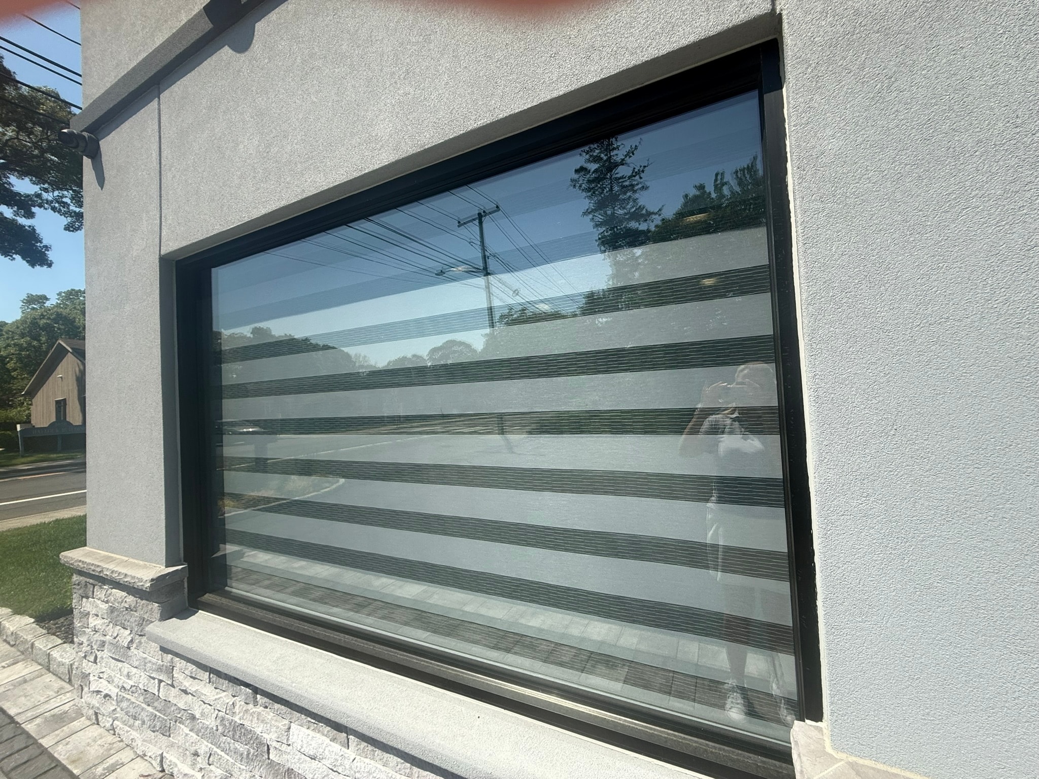 Modern glass garage door with horizontal stripes