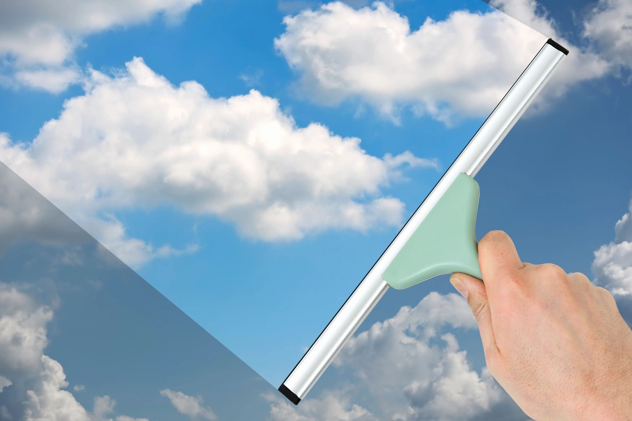Squeegee blue sky window cleaning